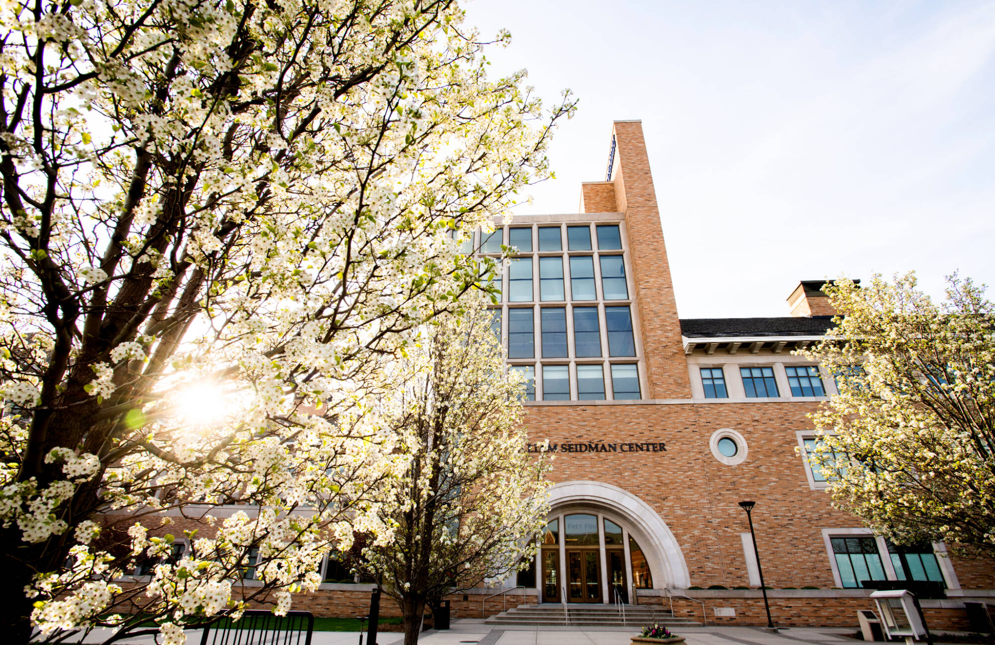 Seidman College of Business exterior with spring blooms
